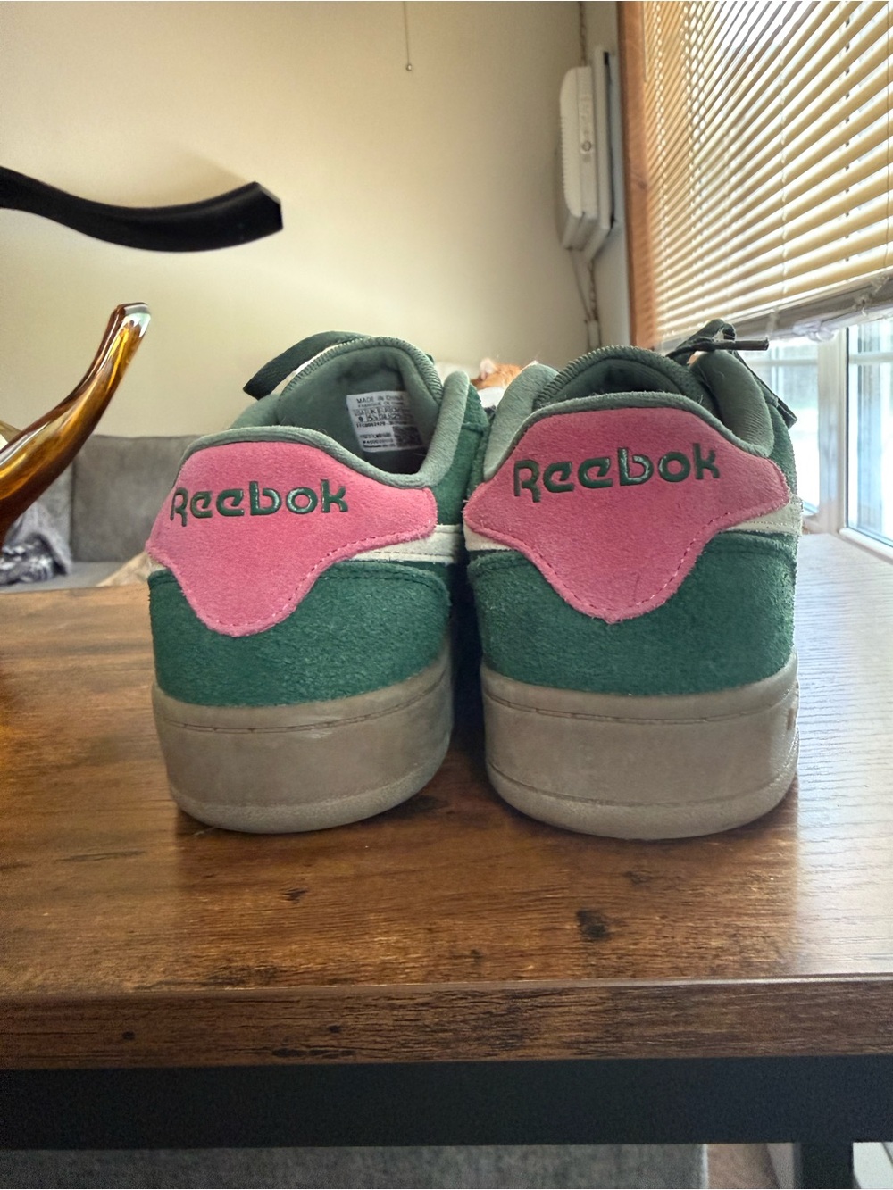 Woman’s Reebok Green Suede Sneakers with Pink Heel Accents